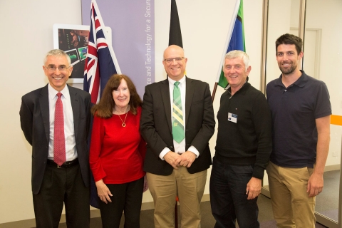 Alumni Christine Scala and Brian Dixoneither side of Professor Schonberg, with Stephen Cimpoeru (left) and Shannon Ryan of DST.